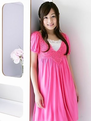 Beautiful gravure idol is adorable in cute little pink dress